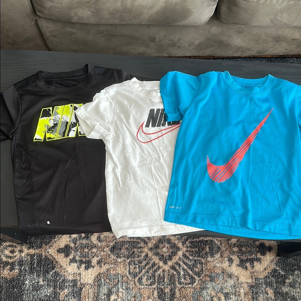Nike youth small Graphic T-Shirts - Black, White, and Blue